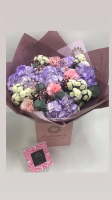 pinks white and lilca hand tied with chocolates