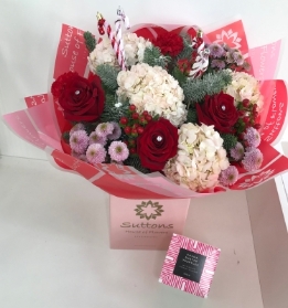 candy cane hand tied with chocolates