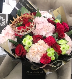 pink,red and green hand tied with crown