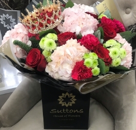 pink,red and green hand tied with crown